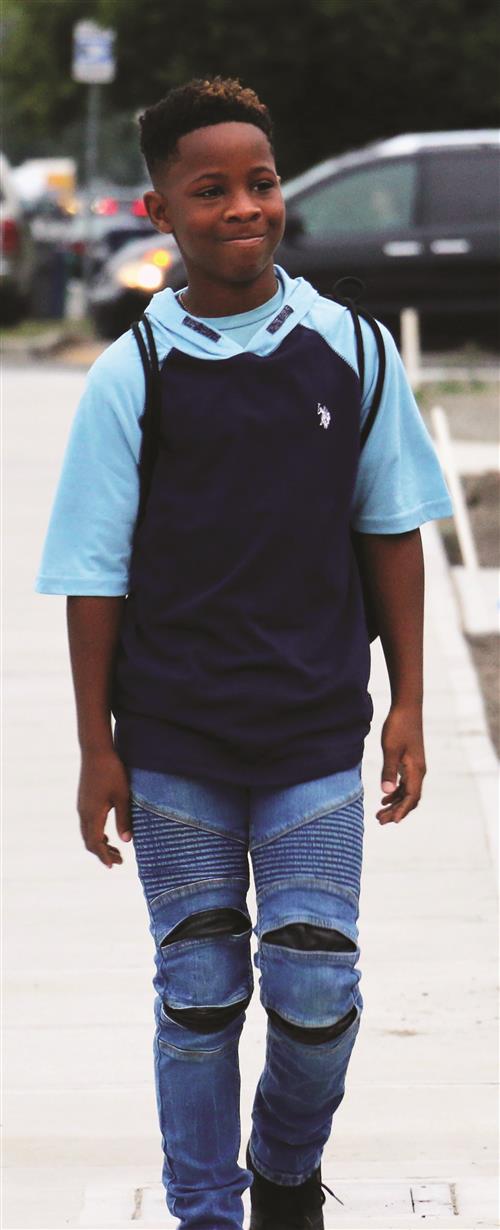 Middle school student walking to school.